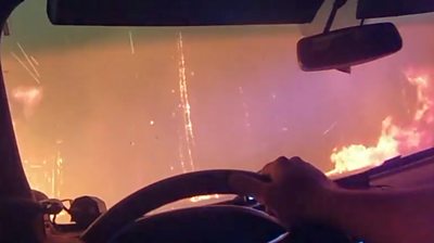 Inside of a car as it drives through fire