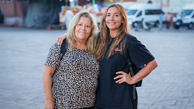 Helene Blatt & Mel Blatt standing on a street with backpacks