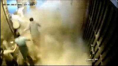 CCTV shows people running from a building collapse