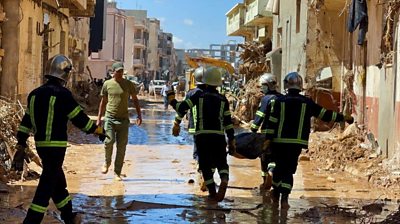 Rescuers in Libya carrying a stretcher