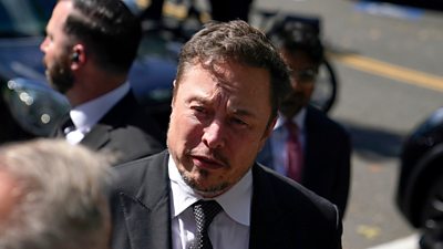 Elon Must talking to reporter
