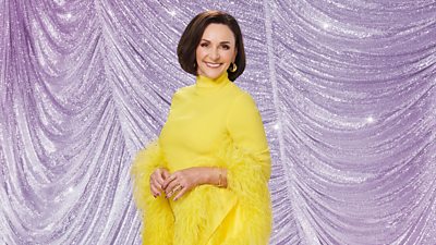 Shirley in a yellow dress