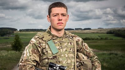 Man in army uniform in a field