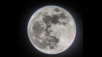 Image of Harvest supermoon lit up in the sky