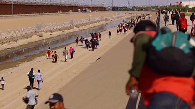 Migrants next to the US - Mexico border