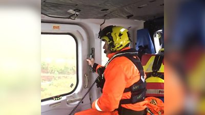 HM Coastguard helicopter rescue stranded people