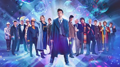 All the Doctors standing in a V with David Tenant at the front. Space background - doctor who 60th anniversary