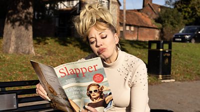 Diane Morgan as character Mandy reading a magazine called Slapper
