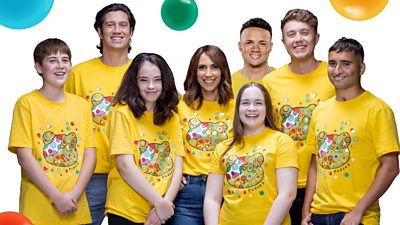 Four children and Alex Jones, Roman Kemp, Vernon Kay and Jermain Jenas smiling wearing children in need t-shirts