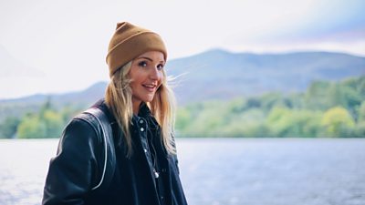 Helen Skelton smiling with lake in background