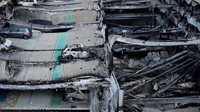 Drone video shows the extent of the car park fire, which destroyed more than 1,400 vehicles.
