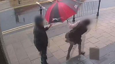 A man has been arrested after a woman in Dewsbury had a paving slab thrown at her head.