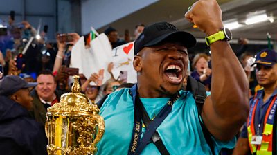 Bongo Mbomambi with the Rugby World Cup Trophy