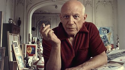 Portrait of artist Pablo Picasso as he smokes a cigarette in his studio, Cannes, France, 1956