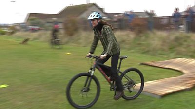 Catherine, Princess of Wales, riding a bike