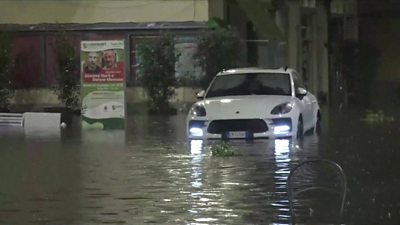 A car in flood water in Italy