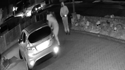 CCTV of a car being stolen on a driveway.