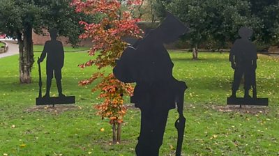 Soldier silhouettes installed in Salford park in remembrance tribute.