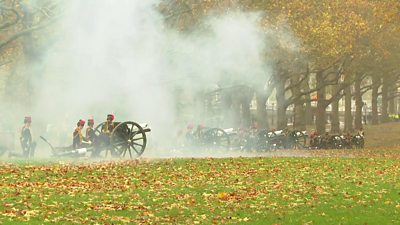 A cloud of smoke is visible after the firing of a cannon in Green Park