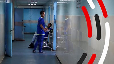 A medical worker in a corridor at Al-Shifa hospital