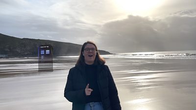 Journalist Catriona Aitken on Southerndown Beach with the tardis behind her