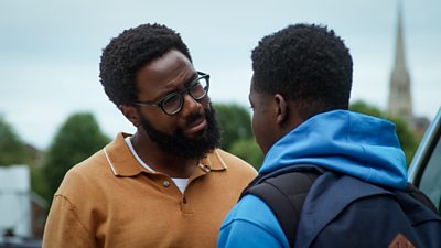 Gus (Daniel Lawrence Taylor) smiles kindly as he listens to Jaheim (Josh Tedeku)