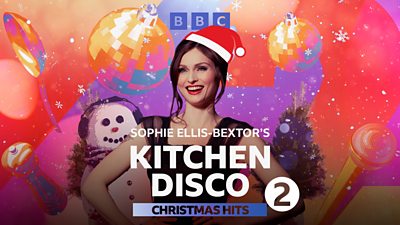 Artwork for Sophie Sophie Ellis-Bextor’s Kitchen Disco: Christmas Hits. Features a picture of Sophie wearing a cartoon Santa hat, stood in front of a range of festive cartoon drawings. 