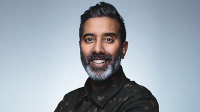 Headshot of presenter Nihal Arthanayake smiling to camera. 