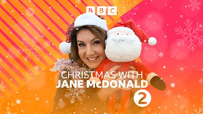 Jane McDonald smiles to camera, wearing a Santa hat and holding a cuddly toy Santa. Text on the image reads: “Christmas with Jane McDonald”