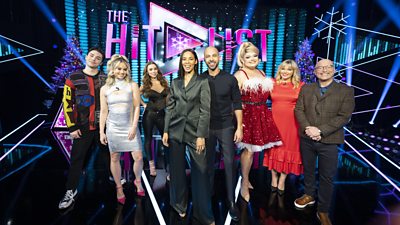 Left to right: George Shelley, Kimberly Wyatt, Una Healy, Rochelle Humes, Marvin Humes, Kitty Scott-Claus, Kate Thornton and Gregg Wallace on the set of The Hit List