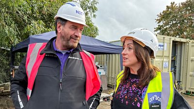 Nick Knowles and Natalie Cassidy wear hard hats and hi-vis vests