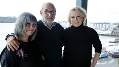 Dawn French, Alan Yentob and Jennifer Saunders stand by a window