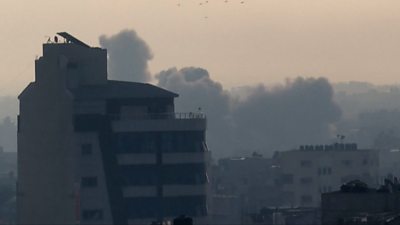 Smoke rising over a building in Rafah