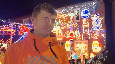 Bradley Ilsley in front of all his Christmas decorations