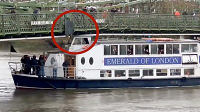 Passenger boat gets stuck under bridge