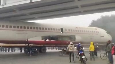 Air India plane stuck under a bridge