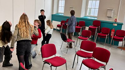 Children play in a classroom style setting