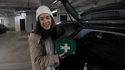 Sabrina showing first aid kit