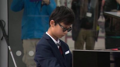 13-year-old Chapman Shum plays piano at The Royal London Hospital in Whitechapel.