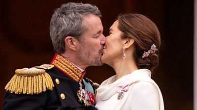 King Frederik X kisses his wife, Queen Mary