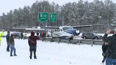Small plane parked on highway