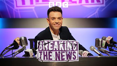 Artwork for BBC Radio Scotland's Breaking the News, featuring Des Clarke sat behind a desk covered in microphones.