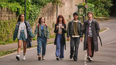 Left to right: Cara (Asha Banks), Pip (Emma Myers), Lauren (Yali Topol Margolith), Zach (Raiko Gohara) and Connor (Jude Collie) walk down a road together