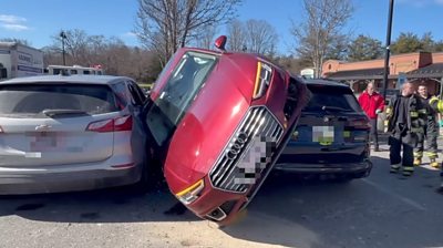Car wedged between two other cars