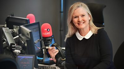 Martha in the Today programme studio facing the camera with a mic in front of her and headphones in her hand