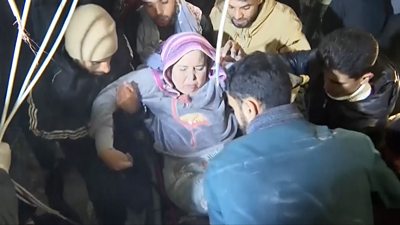 Person carried onto stretcher in Rafah