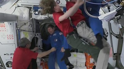 Astronauts embrace