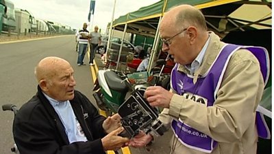 The above picture shows Stirling Moss and me at Silverstone for the 91ȱ in 2010. He is in a wheelchair recovering from falling down the lift-shaft at his London home, breaking bones in his feet. It happened on a Saturday evening when he and his wife Susie and son Elliot were going out for a curry. Stirling emailed me these details after leaving hospital. Apparently, he heard the lift arrive and when the doors opened the lift was still on the ground floor! 