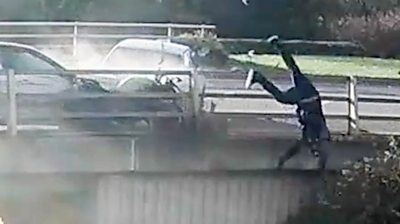 Video shows a rider being pushed against railings by a car after a disagreement with a driver.