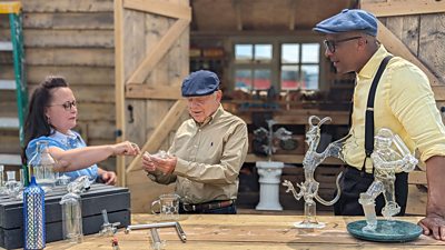 Sir David Jason and Jay Blades examine glasswear